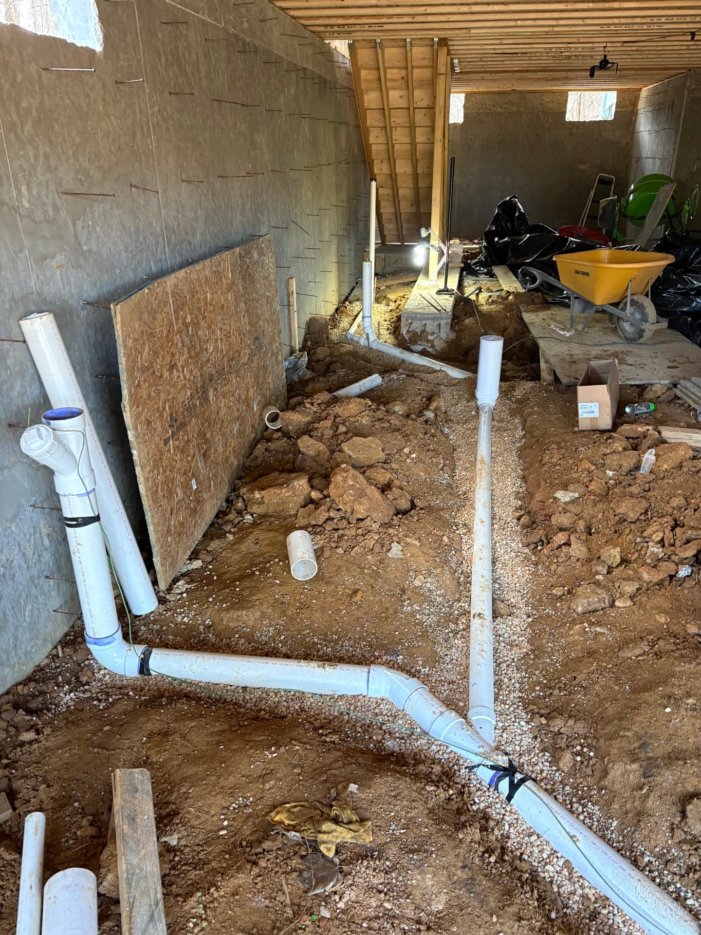 New PVC under-slab drainage rough-in laid in gravel before a concrete pour in Hanover, MD — ProStream Plumbing