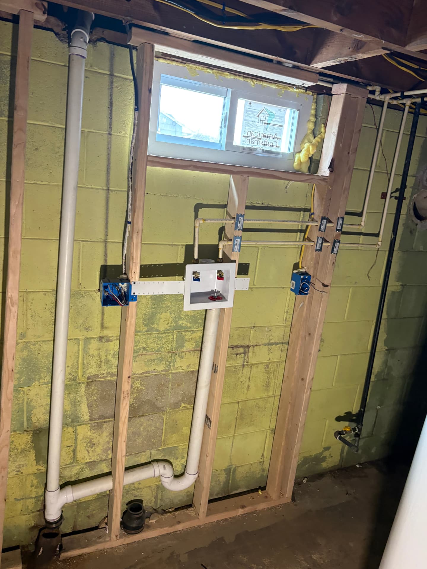 Laundry room rough-in with washing machine outlet box in wood framing in Odenton, MD — ProStream Plumbing