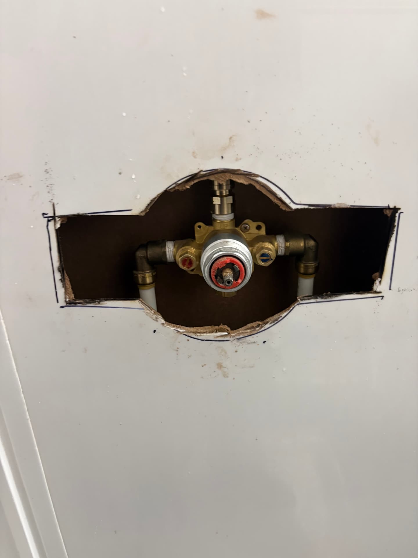 New shower mixing valve rough-in installed behind a wall panel in Baltimore, MD — ProStream Plumbing