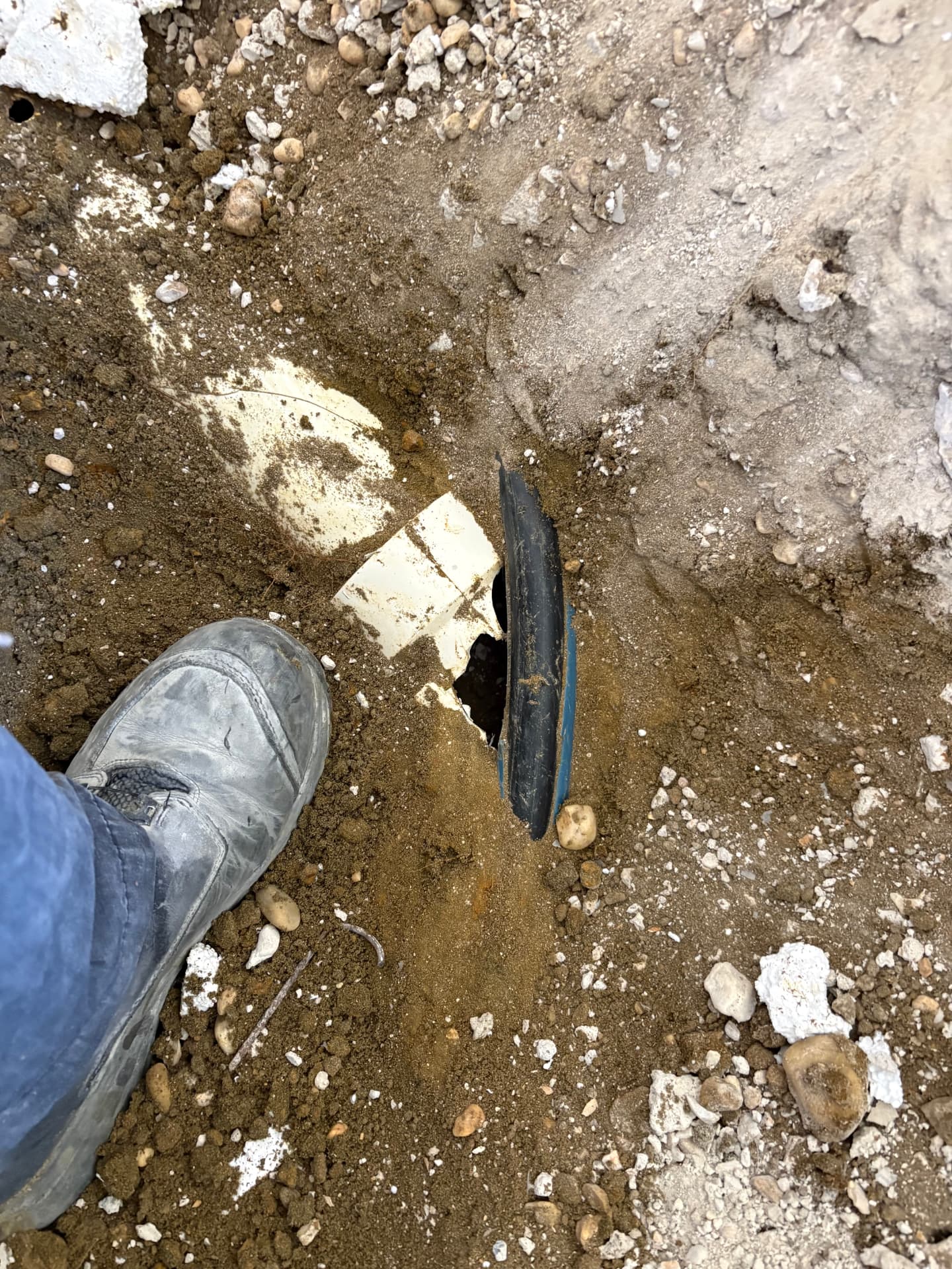 Cracked underground water service pipe exposed during excavation in Odenton, MD — ProStream Plumbing