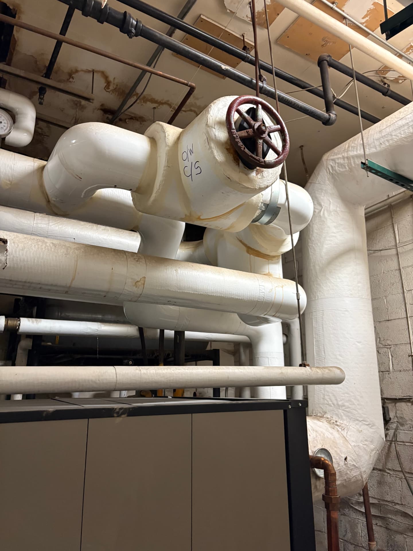 Insulated mechanical room piping with a large gate valve in Baltimore, MD — ProStream Plumbing