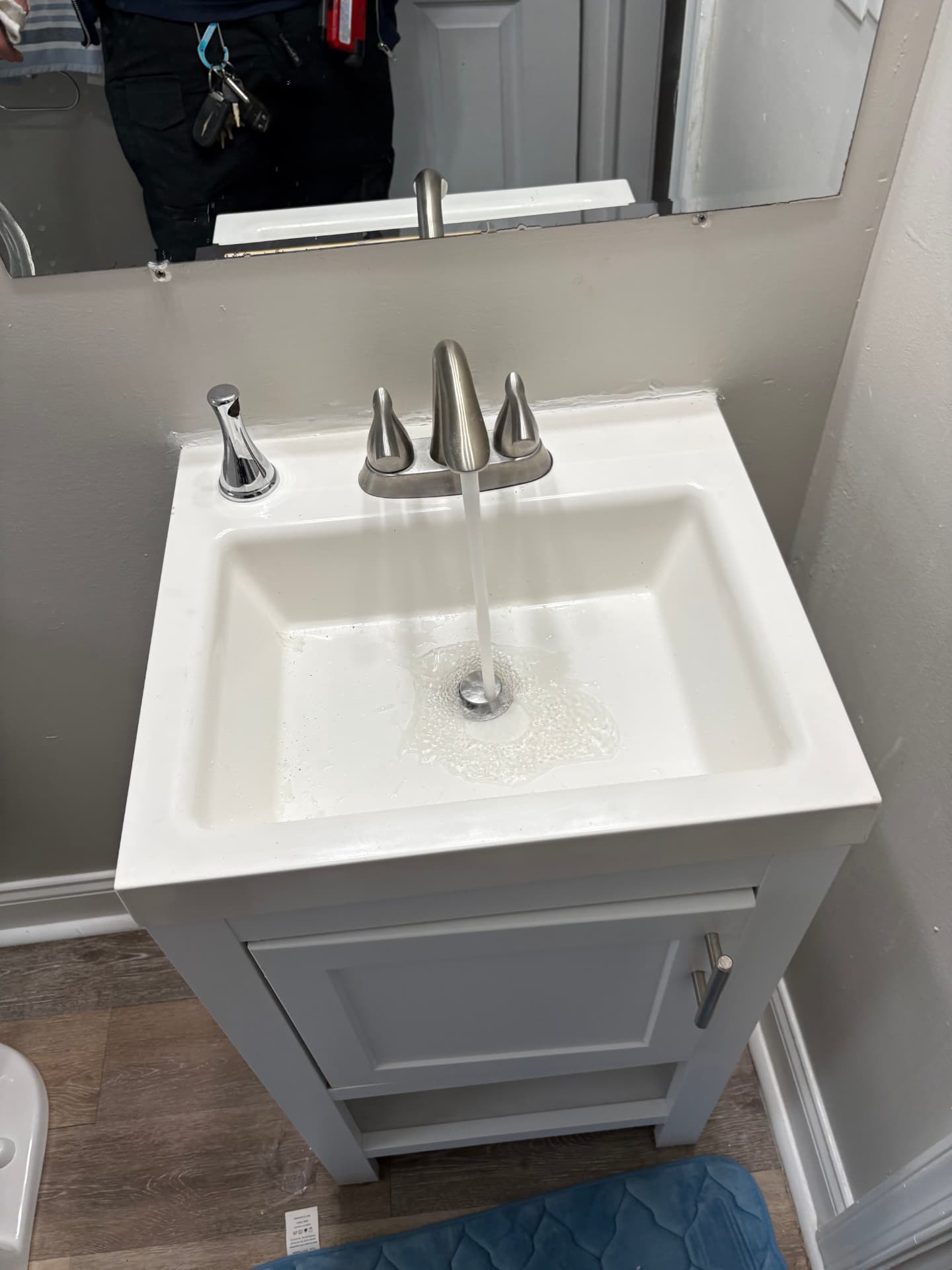 New bathroom vanity with brushed nickel faucet installed in Annapolis, MD — ProStream Plumbing
