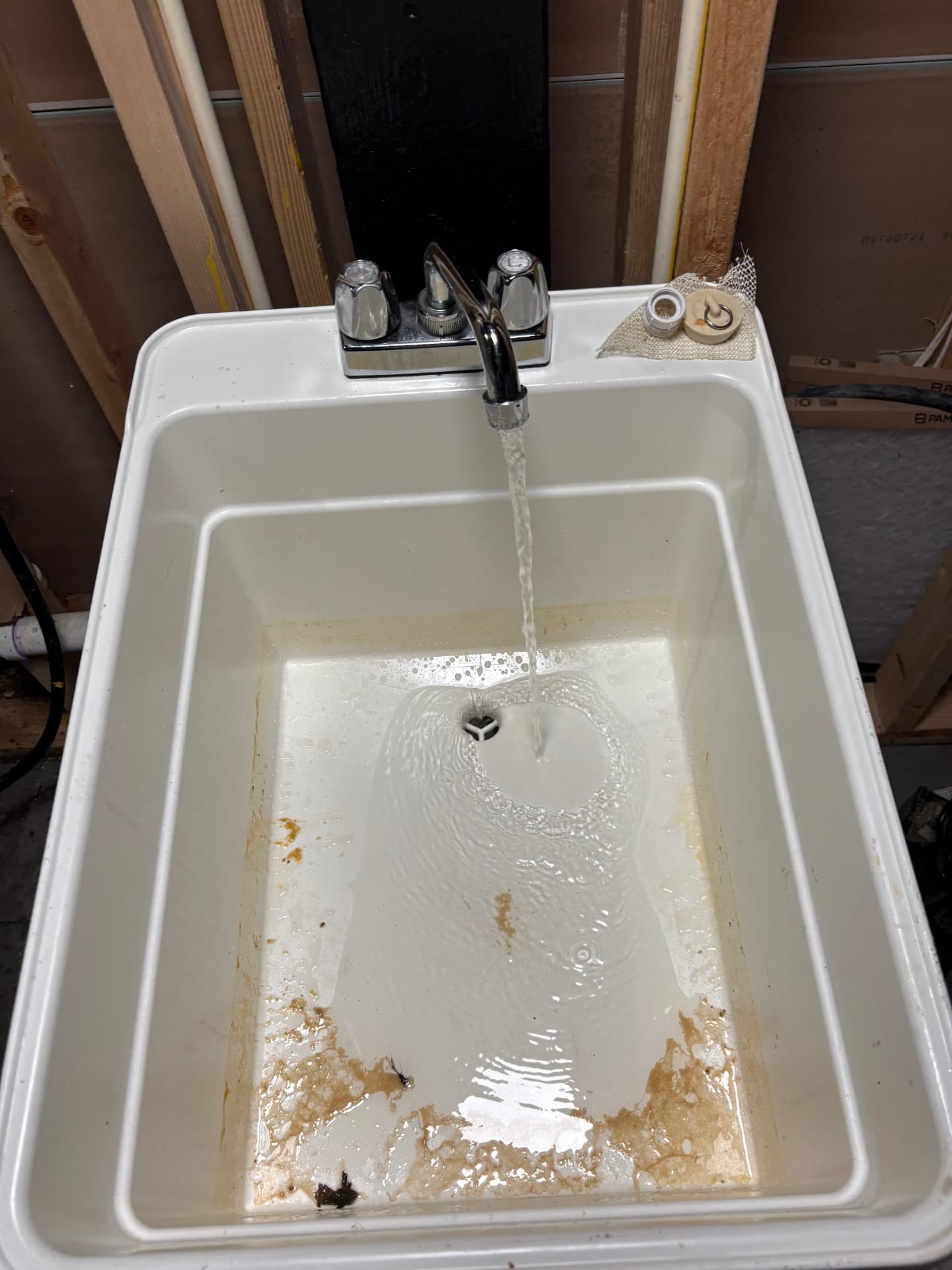 Utility sink draining clear after a drain cleaning service in Baltimore, MD — ProStream Plumbing