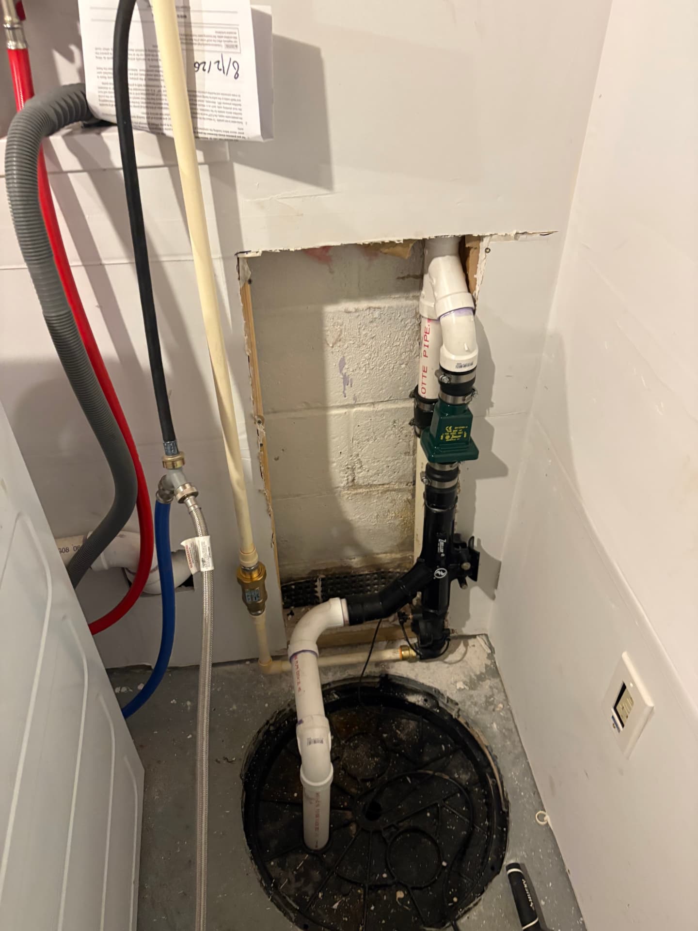 New sump pump and backup system installed in a basin with PVC discharge in Pasadena, MD — ProStream Plumbing