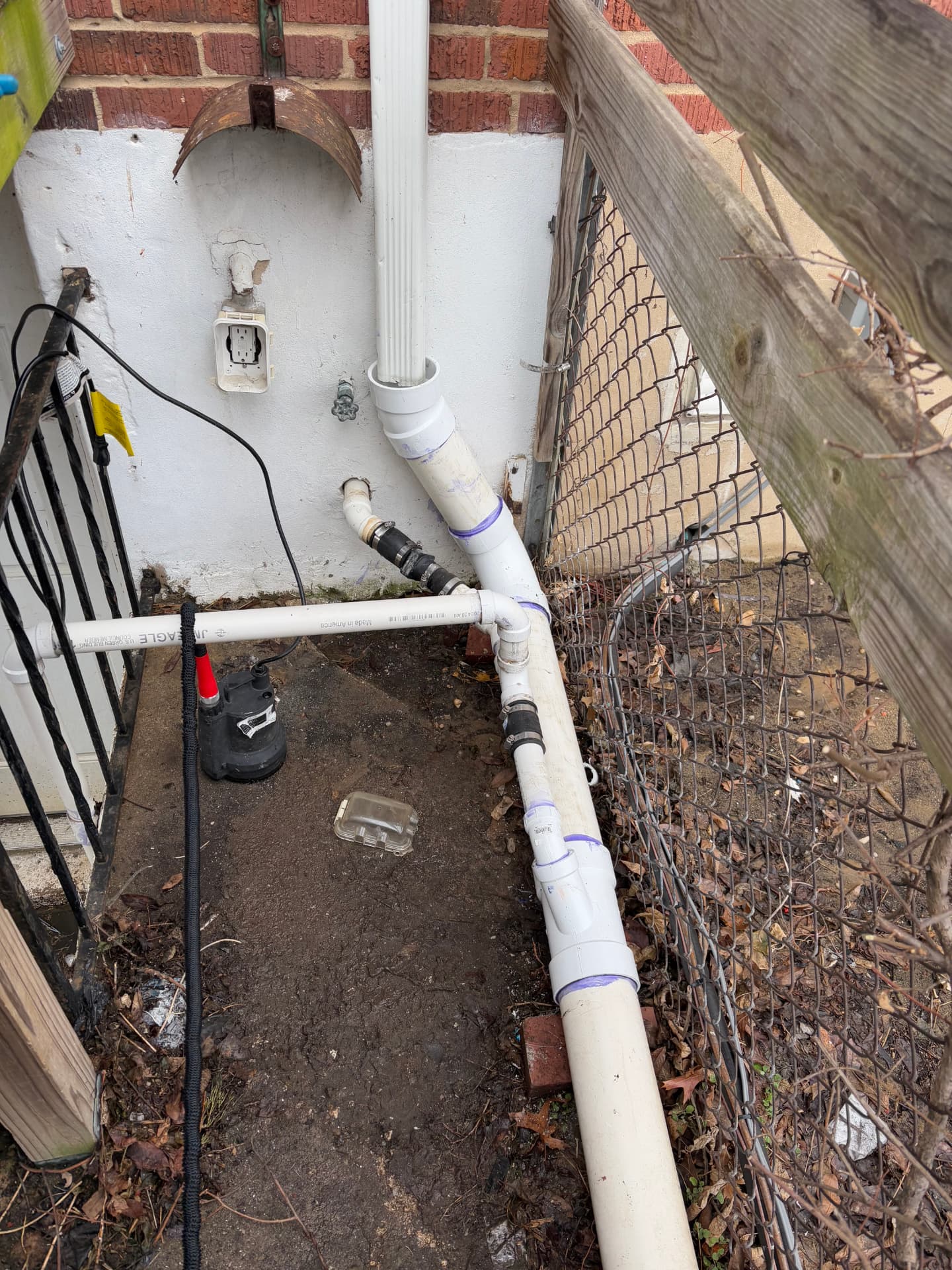 Rebuilt exterior PVC drainage with new cleanouts and downspout connections in Arbutus, MD — ProStream Plumbing
